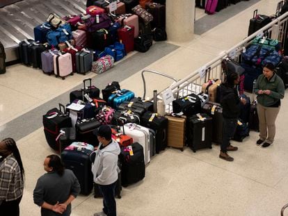 Hundreds of Southwest Airlines checked bags are piled together at baggage claim at Midway International Airport as Southwest continues to cancel thousands of flights across the country in 2022, in Chicago.