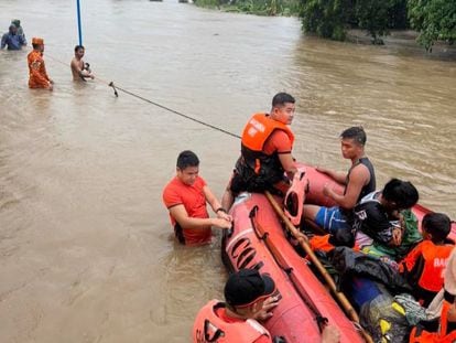 A handout photo made available by the Philippine Coast Guard (PCG) shows Coastguard personnel conducting a rescue mission in the flood-hit town of Bacarra, Ilocos Norte province, Philippines, 26 July 2023.