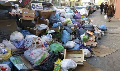 Garbage piles high in a Seville street.