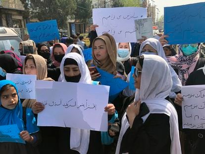 Afghan women chant and hold signs of protest during a demonstration in Kabul, Afghanistan, March 26, 2022.