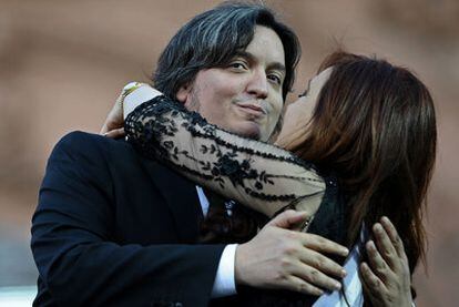 Máximo Kirchner hugs his mother following her swearing in last month.