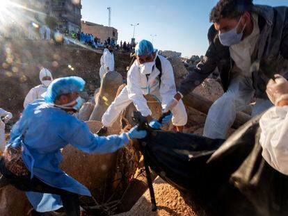 Rescue teams remove a body in Derna on Friday, September 15, 2023.