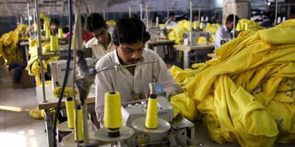 Factory workers create clothing for Pull&Bear in Pakistan.