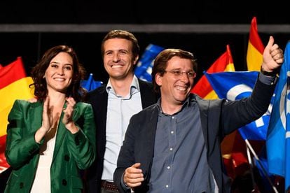 Popular Party leader Pablo Casado (C), celebrates the election results with PP candidate to Madrid's regional government Isabel Diaz Ayuso (l) and PP candidate to Madrid's City Hall Jose Luis Martinez-Almeida.