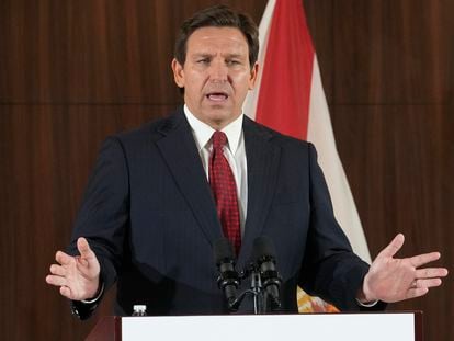 Florida Gov. Ron DeSantis listens to others during a news conference where he spoke of new law enforcement legislation that will be introduced during the upcoming session, Jan. 26, 2023, in Miami.