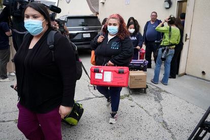 Los Angeles County Public Health Emergency Operations officials leave St. Anthony's Croatian Catholic Church after evaluating the newly arrived migrants being housed in Los Angeles, 2023