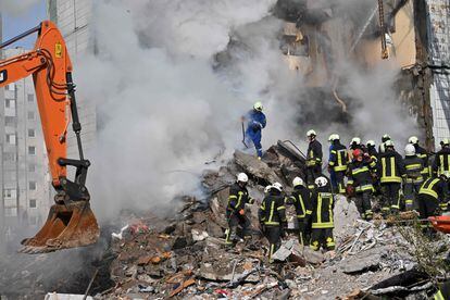 Ukrainian rescue teams search for survivors among the rubble left by a Russian bombardment in the city of Uman.