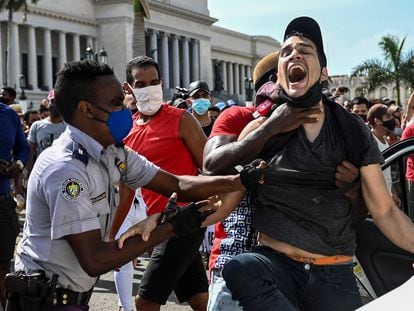 A man is arrested during protests in Havana on July 11.