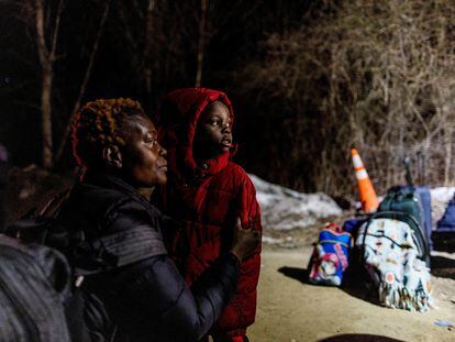 A woman from Congo waits to cross into Canada from New York State in March 2023.
