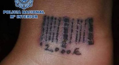 A codebar and price tattooed on a Romanian victim in 2012.