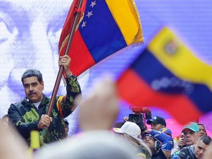 Nicolás Maduro waves a Venezuelan flag at the commemoration of the 1958 coup d'état on January 23.