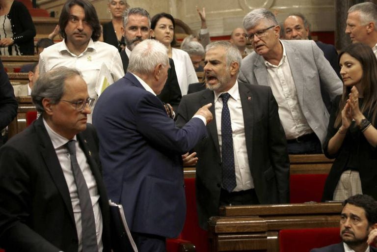 Angry scenes between lawmakers inside the Catalan parliament on Thursday.