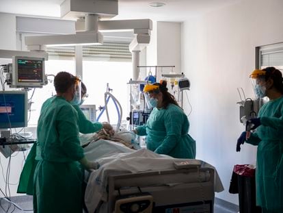 A coronavirus patient is treated in an intensive care unit at the University Hospital of Torrejon in Torrejon de Ardoz on Tuesday.