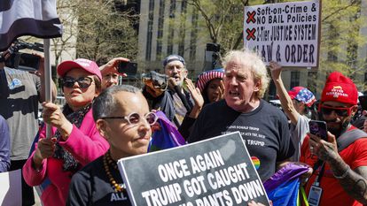 Trump supporters clash with a detractor of the former U.S. president outside the courthouse in New York on April 15.