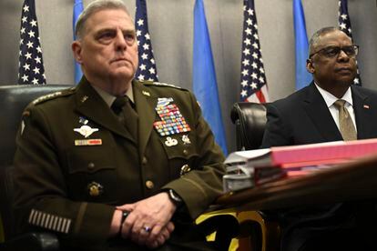 Defense Secretary Lloyd Austin, right, and Chairman of the Joint Chiefs of Staff GenerAL Mark Milley, attend a virtual meeting of the Ukraine Defense Contact Group on March 15, 2023, at the Pentagon.