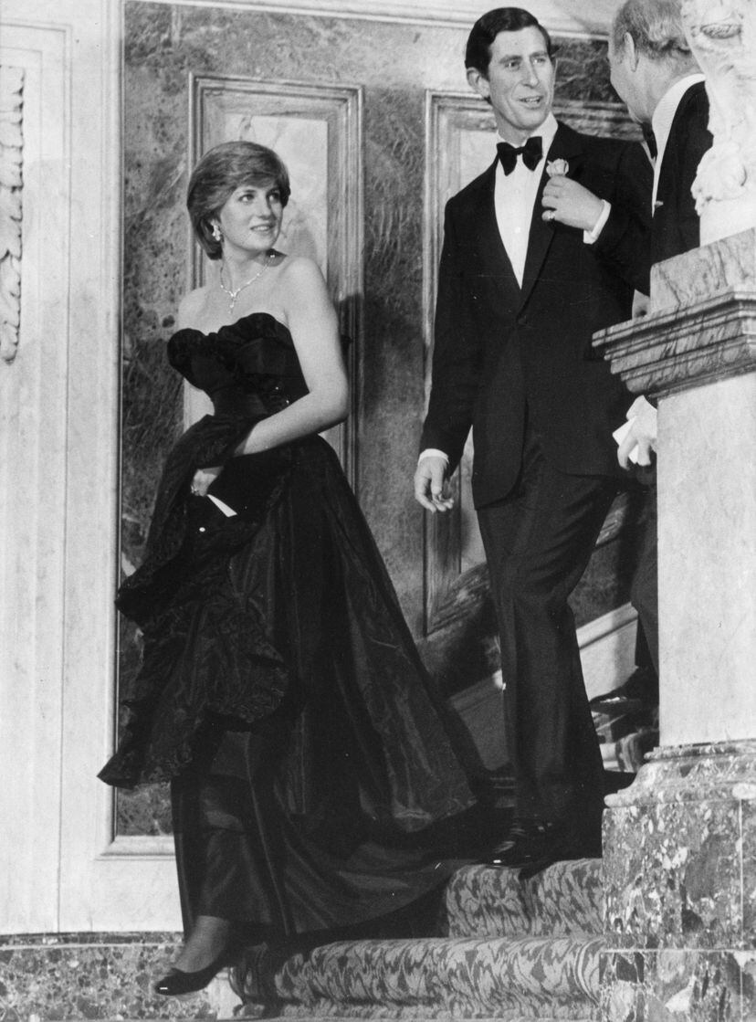 The engaged couple attended their first public event together on March 9, 1981. It was a recital at Goldsmith's Hall in London, where Diana wore a black satin gown with strapless neckline and ruffle detailing by British designer duo David and Elizabeth Emanuel. 