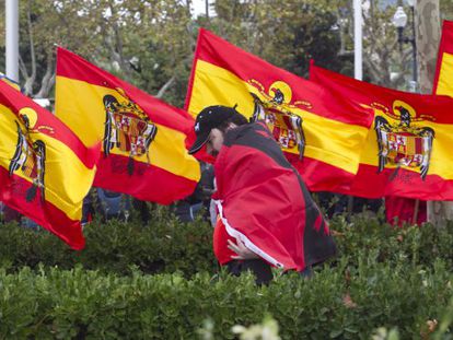 Far-right supporters celebrating Spain&#039;s national day in Barcelona with Franco-era flags. 