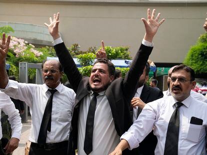 Lawyers and supporters of Pakistan's former Prime Minister Imran Khan chant slogans against the court decision at his residence, in Lahore, Pakistan, Saturday, Aug. 5, 2023.