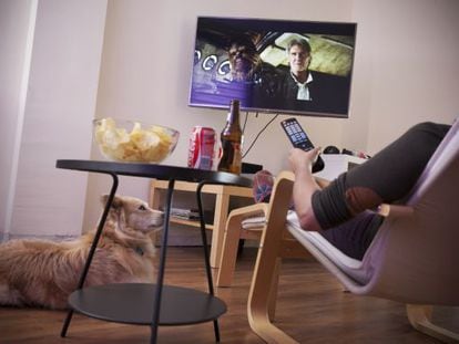 A woman watches the trailer for the new ‘Star Wars’ movie on her TV.