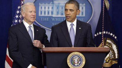 US President Barack Obama delivers a statement on Tuesday after striking a deal to avert a financial crisis, with Vice President Joe Biden at left.  