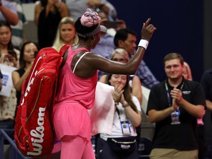 Venus Williams of the U.S. acknowledges fans after losing her first round match against Belgium's Greet Minnen.