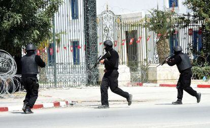 Tunisian security forces surround the area where the attacks took place.
