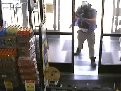 Ryan Christopher Palmeter, 21, is shown in a still image from surveillance video holding a rifle at a Dollar Store after being identified as the white man who killed three Black people before shooting himself August 26, 2023 in Jacksonville, Florida.