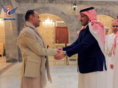 In this handout photo released on April 9, 2023 by the Houthi group’s media arm Ansar Allah, head of the Houthi’s supreme political council Mahdi al-Mashat, left, shakes hands with Saudi Arabia’s Ambassador to Yemen Mohammed bin Saeed Al-Jaber, in Sanaa, Yemen