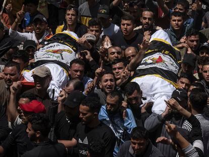 Palestinians carry the bodies of Islamic Jihad commander Ali Ghali, left, and his brother, Mohammed Ghali, both killed in an Israeli airstrike in Khan Younis, southern Gaza Strip, Thursday, May 11, 2023.