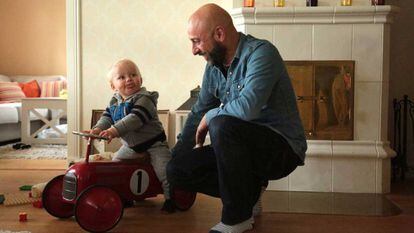 Pablo Capa plays with his 15-month-old son at his house in Kirkkonummi, Finland.