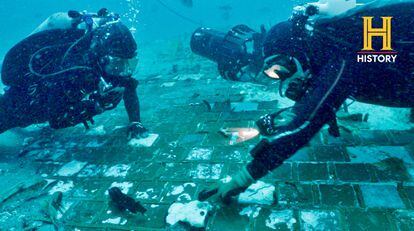 Two underwater researchers examine a segment of the space shuttle 'Challenger' in waters off the coast of Florida during the filming of a 'History Channel' documentary.