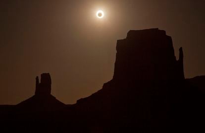 annular eclipse over West Mitten, left, and East Mitten buttes in Monument Valley, Ariz