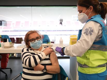 A woman receives a dose of the AstraZeneca vaccine in Madrid's Wanda Metropolitano stadium at the end of March.