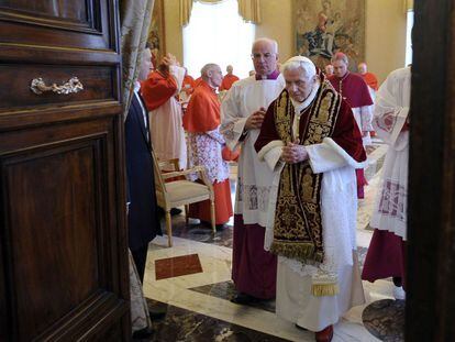 Pope Benedict XVI leaves the meeting of the College of Cardinals held at the Vatican on February 11, 2013, where he announced his resignation.