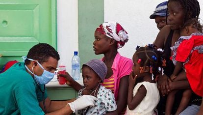 A doctor treats patients in Haiti in 2010.