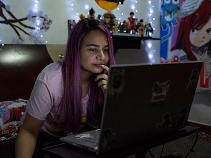 Oskarina Fuentes works on her computer.