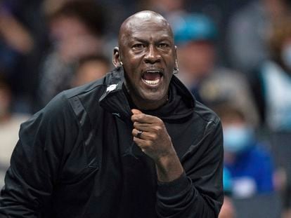 Michael Jordan looks on during the first half of an NBA basketball game between the Charlotte Hornets and the New York Knicks in Charlotte, North Carolina, in 2021.