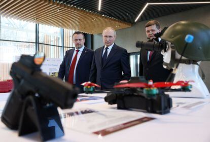 Russian President Vladimir Putin (center) visits an exhibition at the Novgorod Technical College on Wednesday.