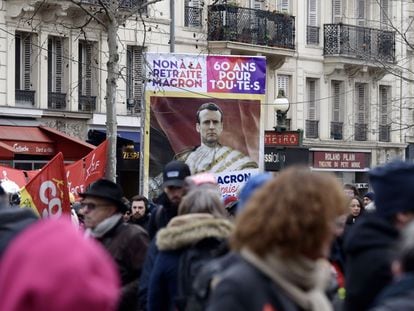Protesters carry a sign with the slogan "No to Macron's pension. 60 years for all", in the Place de la République in Paris on January 19.