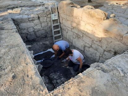 Archaeologists are excavating an underground storeroom.