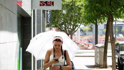 A woman walks in Lleida, which saw its highest temperature ever.