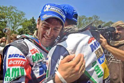 Marc Coma is congratulated by teammate Joan Pedrero