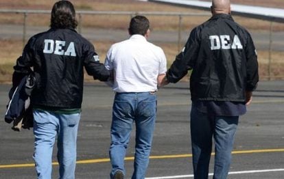 DEA agents arrest a drug suspect.