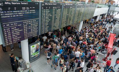 Passengers at Munich airport after 130 flights were cancelled.