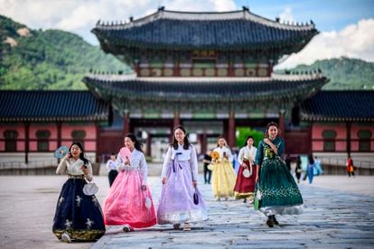 A group of South Korean women in traditional dress visit Gyeongbokgung Palace in Seoul, on July 1, 2022.