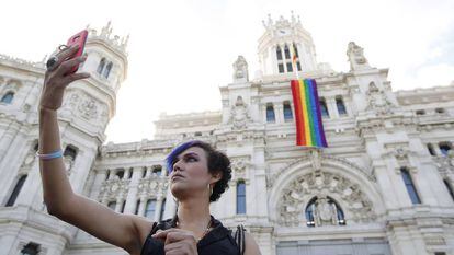 The gay pride flag hangs from Madrid City Hall.