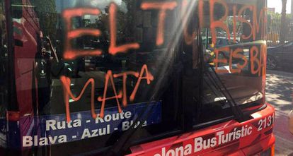 The bus was sprayed with the words “Tourism kills the barrio.”