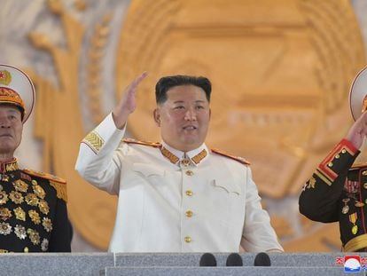 North Korea's Supreme Leader Kim Jong-un in a marshal's uniform salutes during Sunday's military parade