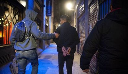 A youth being detained in Barcelona.