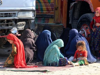 Afghan refugee women and children sit at a registration center after arriving from Pakistan near the Afghanistan-Pakistan border in Spin Boldak district of Kandahar province, Afghanistan, November 28 2023.